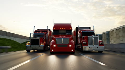 American style truck on freeway pulling load